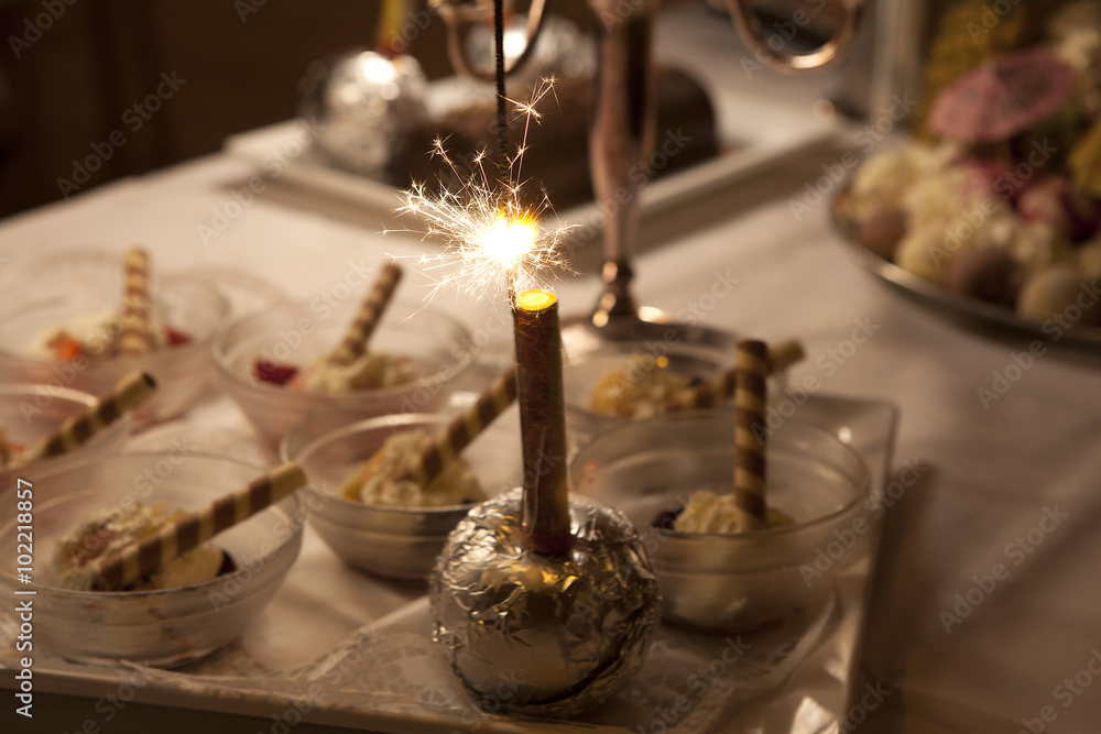 Sparkler on ice cream buffet