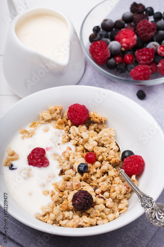 Healthy breakfast. Granola, muesli with yogurt and fresh berries