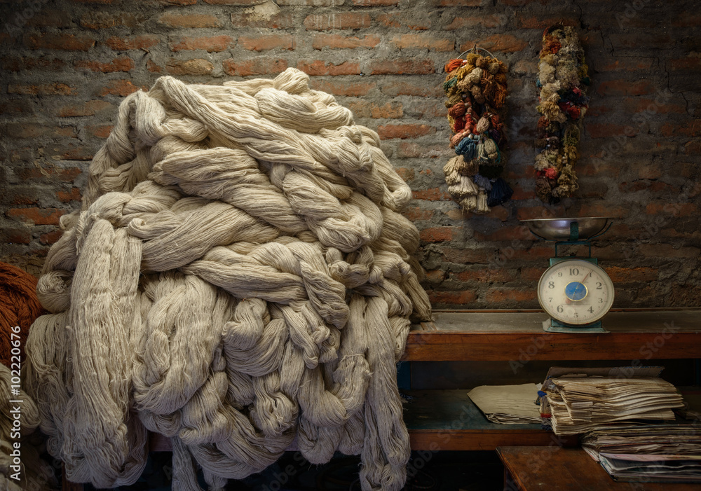 Plain wool before dyeing in a rug factory - obrazy, fototapety, plakaty 