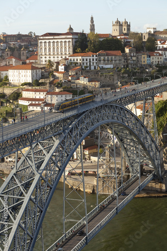 Dom Luis I Bridge. Built in 1887, the Dom Luis I Bridge is a two tiered bridge that spans the Douro River that runs through Porto, Portugal. The city is built down the steep river banks.