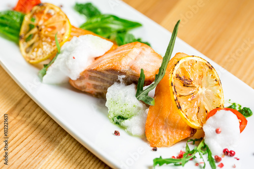 Salmon Steak with Grilled Vegetables, White Sauce and Lime
