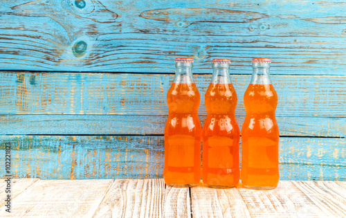 variety of soda bottle on the wooden background