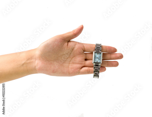hand holding a watch against a white background
