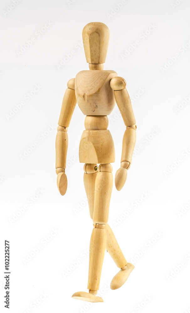 Wooden figure walking on white background Wooden figure walking on white background