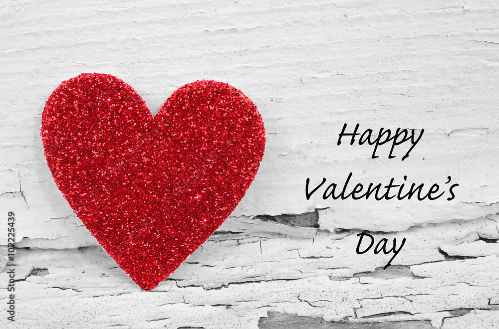 A red Valentine's Day heart on a black and white background, vintage dramatic effect with the text Happy Valentine's Day A red Valentine's Day heart on a black and white background, vintage dramatic effect with the text Happy Valentine's Day