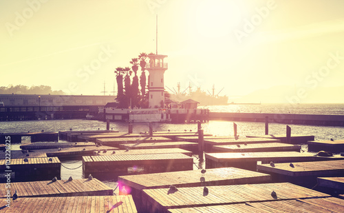 Vintage toned marina in San Francisco at sunset with lens flare