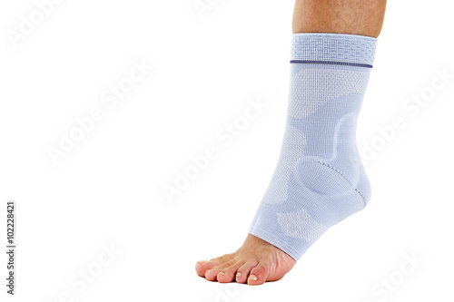 Woman Wearing Flexible Elastic Ankle Brace. photo