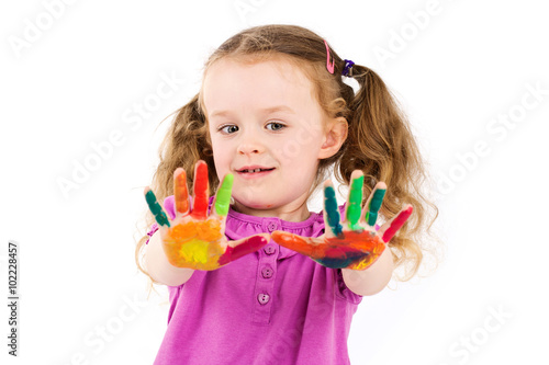Фотография Little girl with  ponytails showing her painted hands