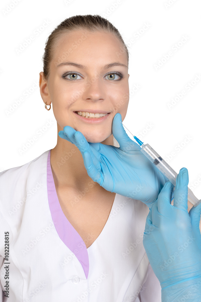 Young beautiful girl getting Botox injection from a syringe Young beautiful girl getting Botox injection from a syringe