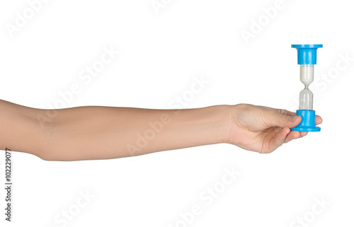 Close-up of a female hand holding hourglass