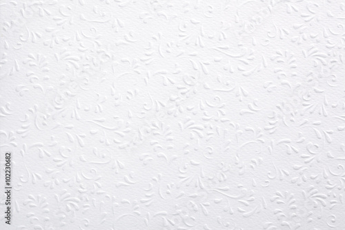 White embossed paper with floral pattern