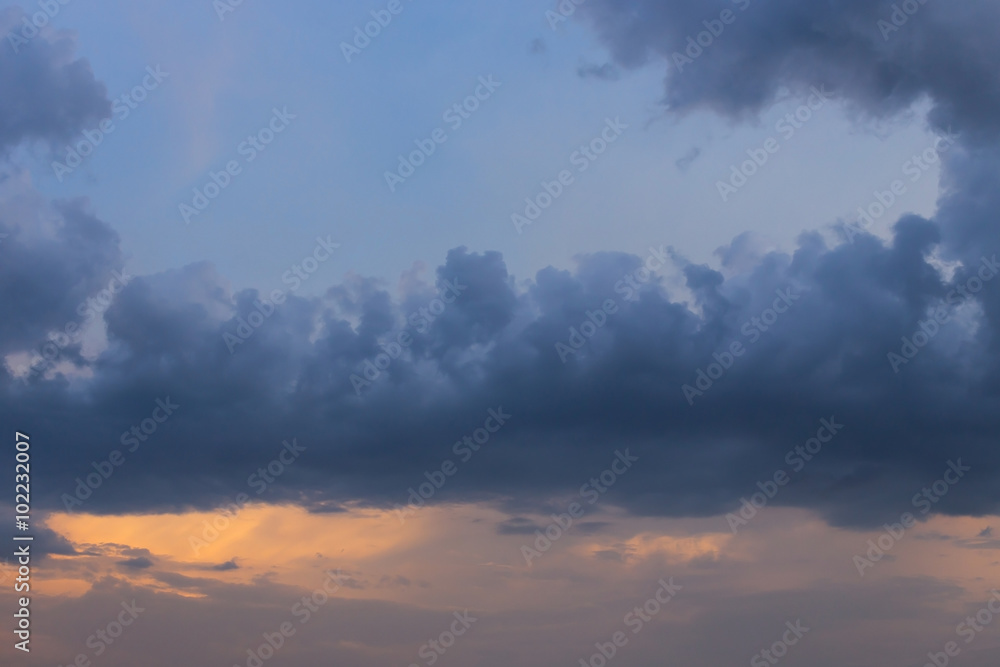 rain cloud on sunset sky background