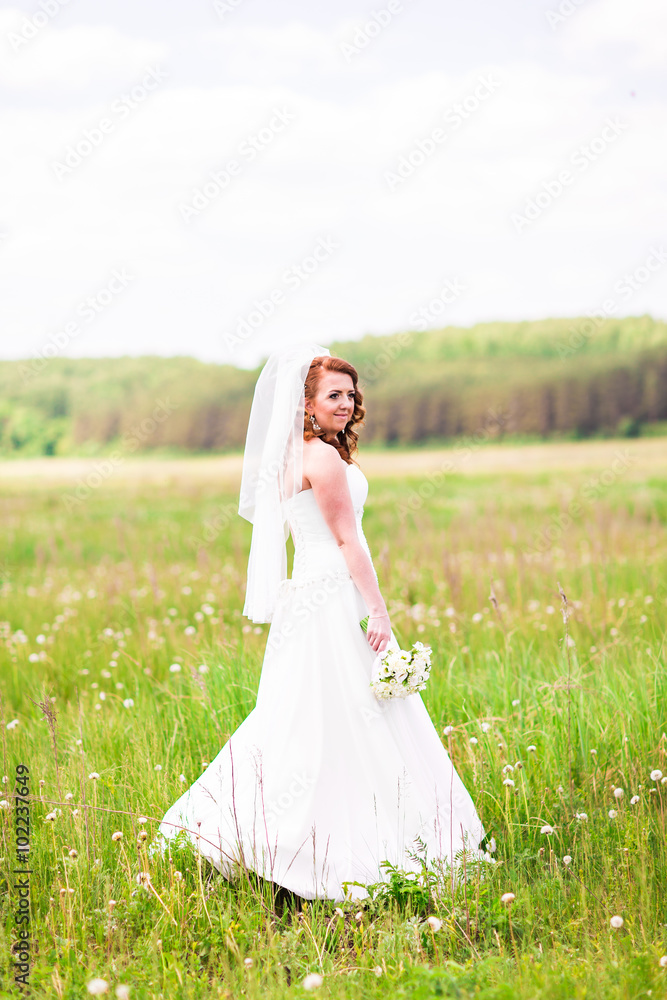 Lovely bride outdoors in a forest