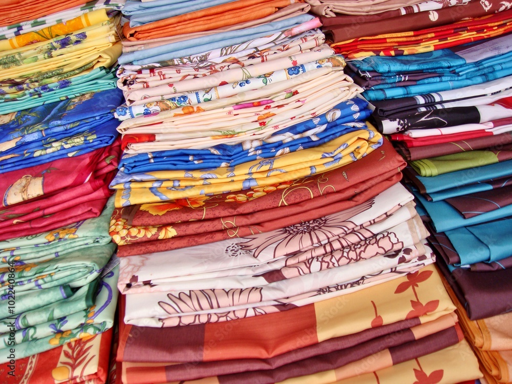 Selection of traditional french oilcloths  (toile cirée) for sale on a local market, Provence, France