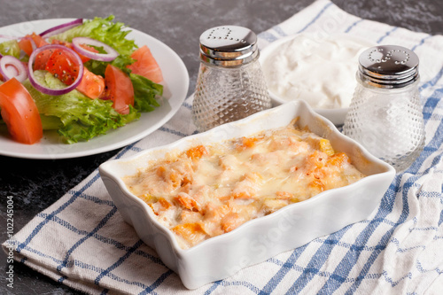 fish gratin with cream, cheese and pumpkin. French dish julienne