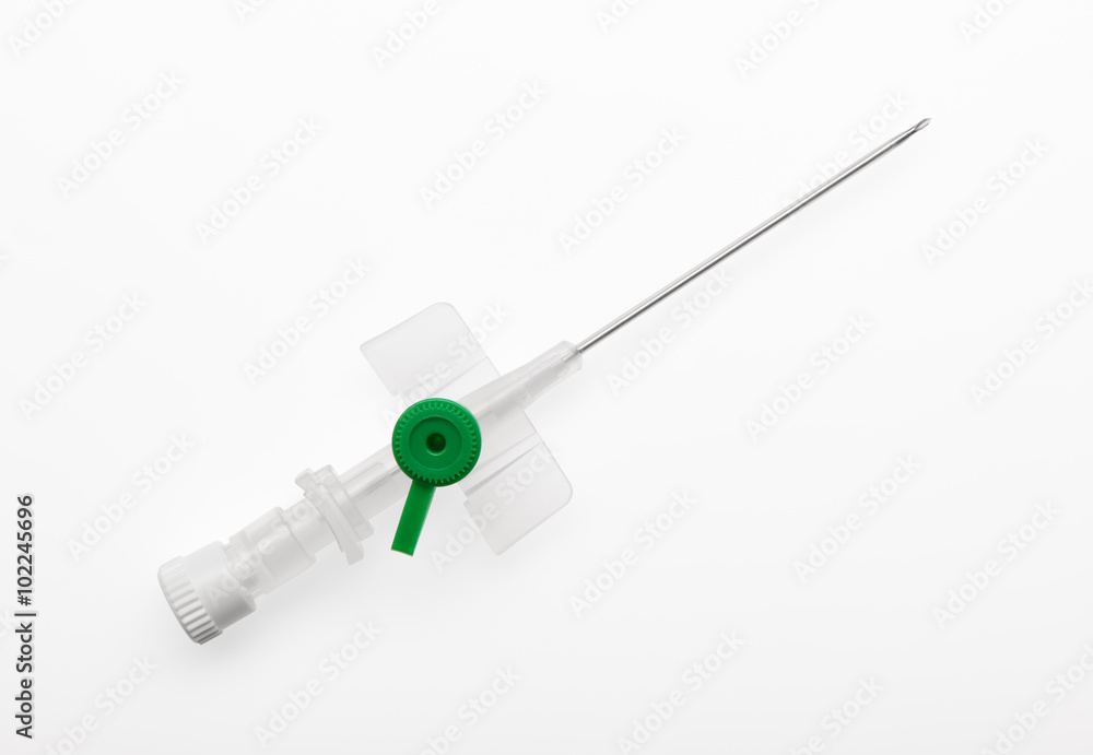 Green plastic catheter with open needle isolated on white