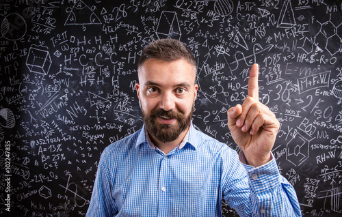 Bilde på lerret Scolding teacher against big blackboard with mathematical symbol