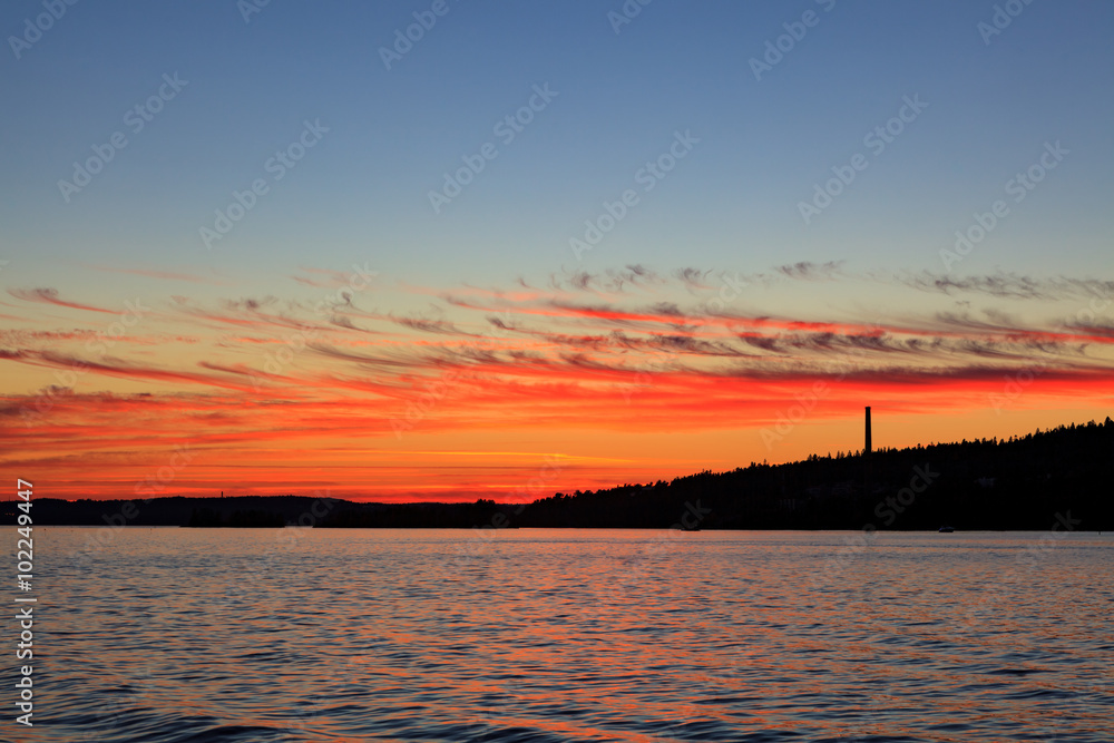 Fototapeta premium Calm sunset and clouds over lake