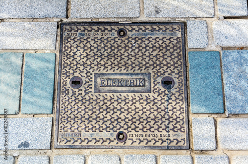 Hatch of sewage on the paving road