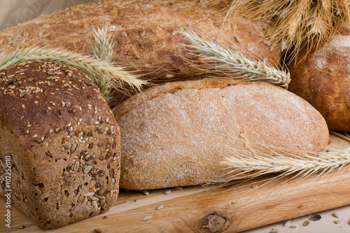 f bread with cereals on a fabric background brown color. photo