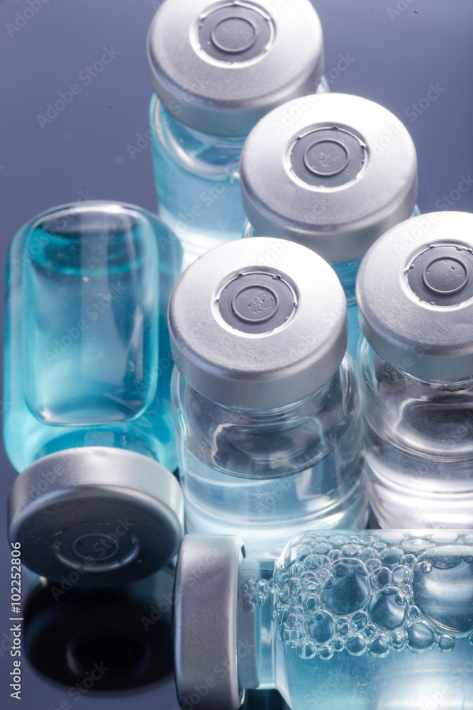  medical ampoules on a black background