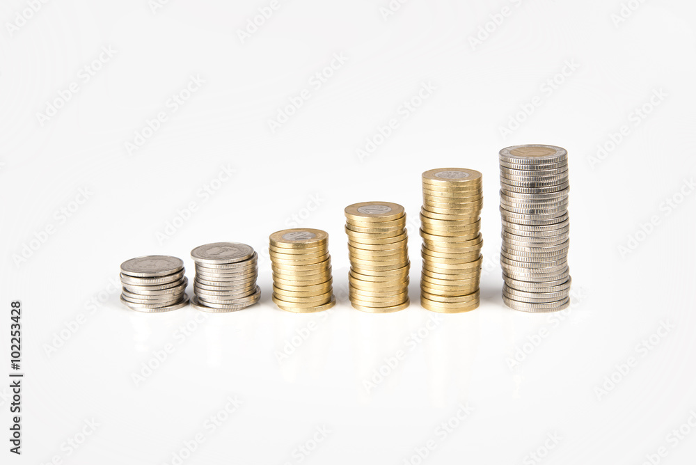 Coins stacked in bars indicate economic growth. Coins stacked in bars indicate economic growth.