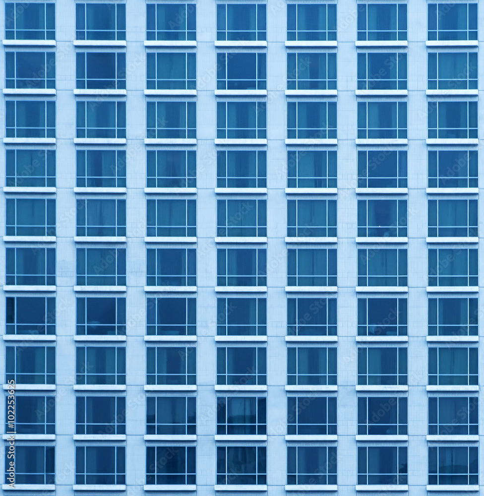 Close-up texture view of blue skyscraper with many windows in Bangkok. Close-up texture view of blue skyscraper with many windows in Bangkok.