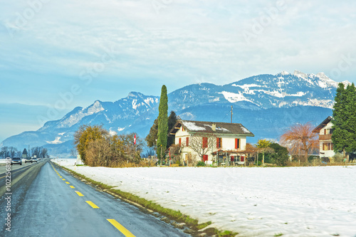 Road View of houses in snow covered Switzerland © Roman Babakin