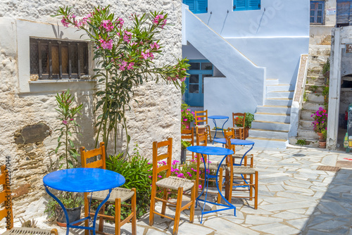 Traditional greek tavern in the narrow streets of Mykonos, Greec