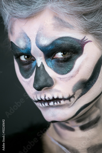  girl in the image of a skeleton on a black background