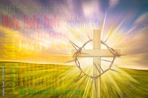 Happy Easter greeting card or background with a cross, crown of thorns and colorful abstract blur background like a meadow at sunset, with copy space for text. photo