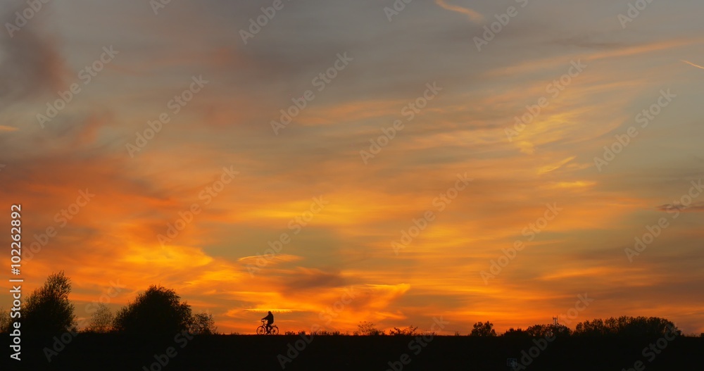 Man by Bicycle Man's Silhouette at Opposite Bank Man by Bicycle Close Up Bright Yellow Sunset at The River Colorful Clouds Cirrus Trees' Silhouettes Man by Bicycle Man's Silhouette at Opposite Bank Man by Bicycle Close Up Bright Yellow Sunset at The River Colorful Clouds Cirrus Trees' Silhouettes