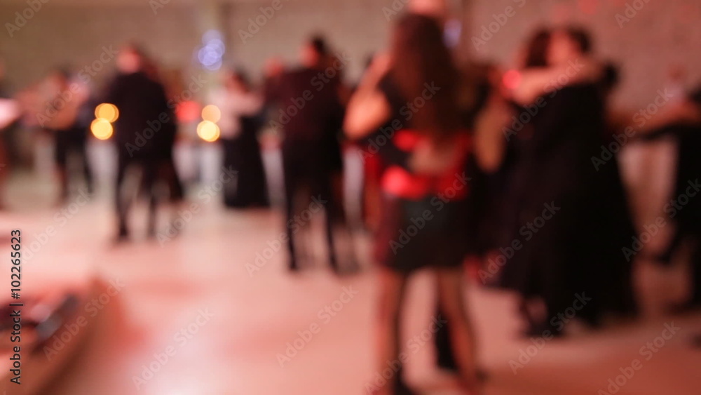 Group of people dancing in a banquet hall with live music Group of people dancing in a banquet hall with live music