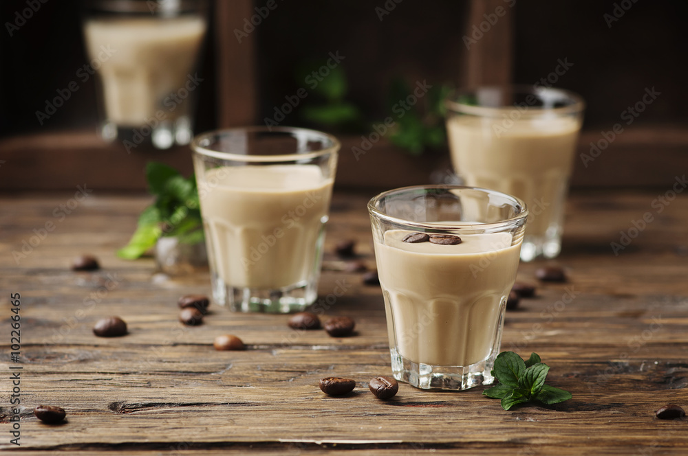Cold cream with coffe and mint on the wooden table Cold cream with coffe and mint on the wooden table