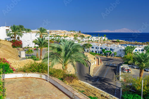 Fototapeta Naklejka Na Ścianę i Meble -  Panorama of white city at a tropical holiday resort, Egypt 