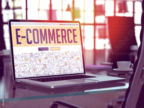 E-Commerce - Closeup Landing Page in Doodle Design Style on Laptop Screen. On Background of Comfortable Working Place in Modern Office. Toned, Blurred Image. 3d Render.  photo