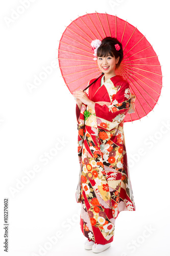 attractive asian woman wearing kimono isolated on white background © taka