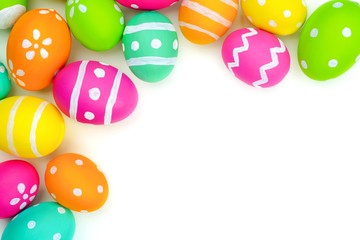 Colorful Easter egg top corner border against a white background