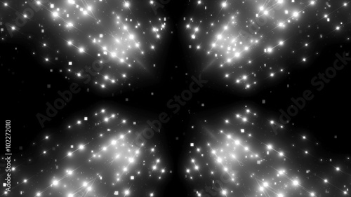 Fractal grey kaleidoscopic background with brilliant particles. Disco spectrum lights concert spot bulb.
