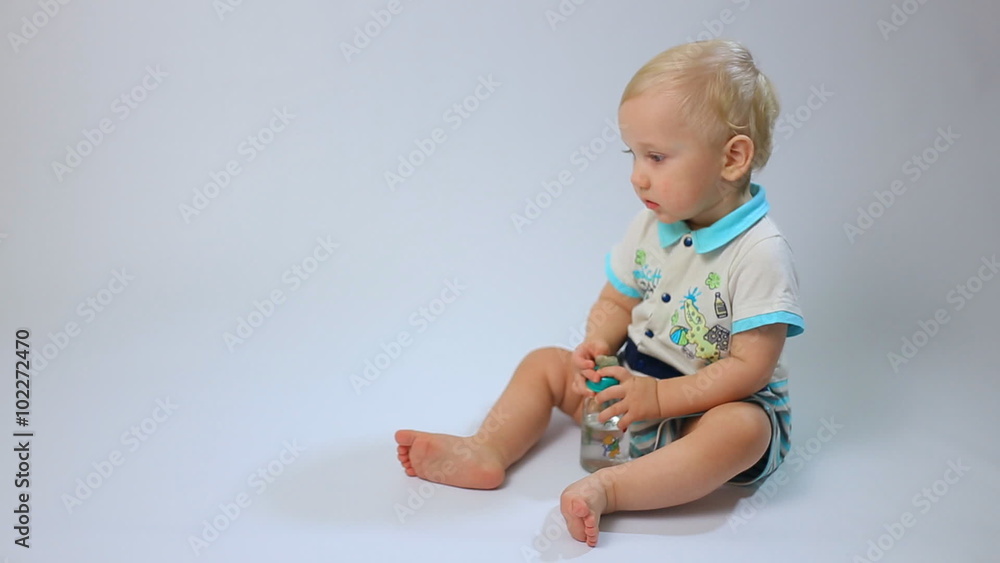 Cute caucasian child, little baby kid toddler boy sits and creeps on white background. Childhood dreams and memories. Cute caucasian child, little baby kid toddler boy sits and creeps on white background. Childhood dreams and memories.