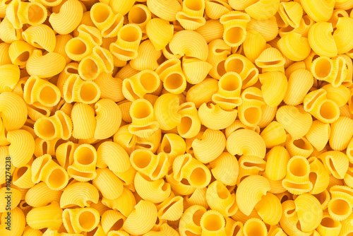 Italian Pipe Rigate Macaroni Pasta raw food background or textur