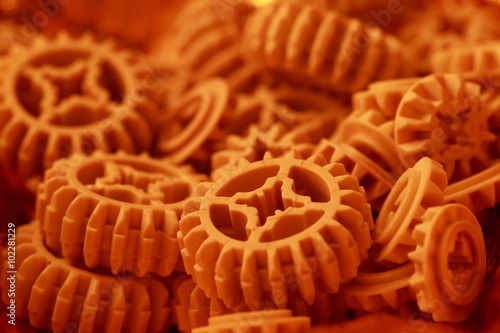 Plastic orange  gears  texture .