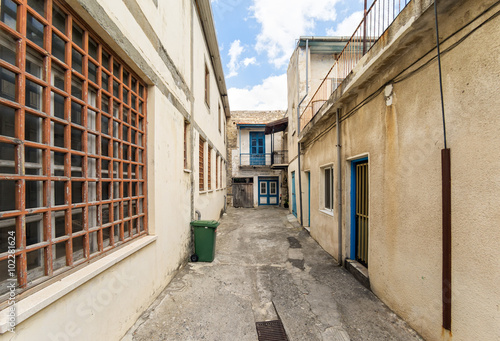 Fisheye view on dead end street and houses with lattice windows. Pano Lefkara, Cyprus.