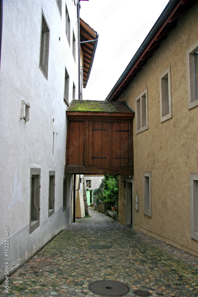 Moving between buildings / Old street in Brugg (Switzerland)