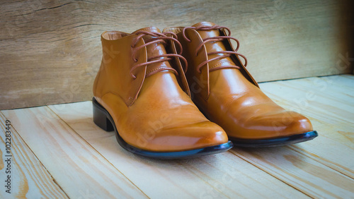 classic brown oxford shoes on wooden background