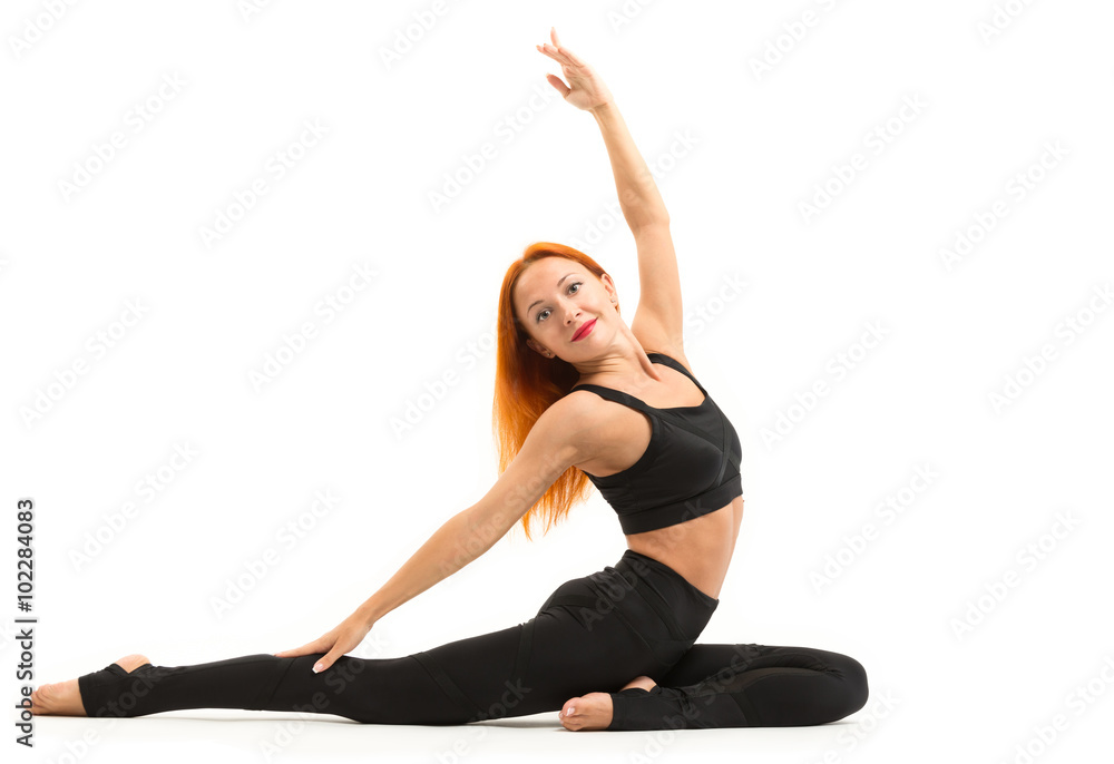 Sporty young woman doing yoga asana