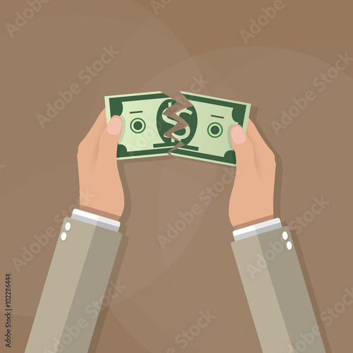 Hands tearing apart money bill in half