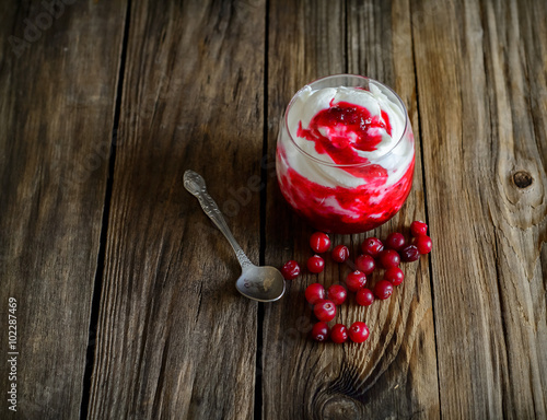 Yogurt with cranberries mashed with sugar