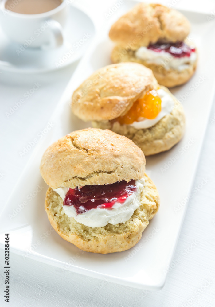 Scones with cream and fruit jam Scones with cream and fruit jam