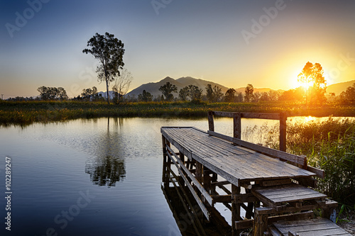Serene Sunrise over fishing Jetty © Cozyta